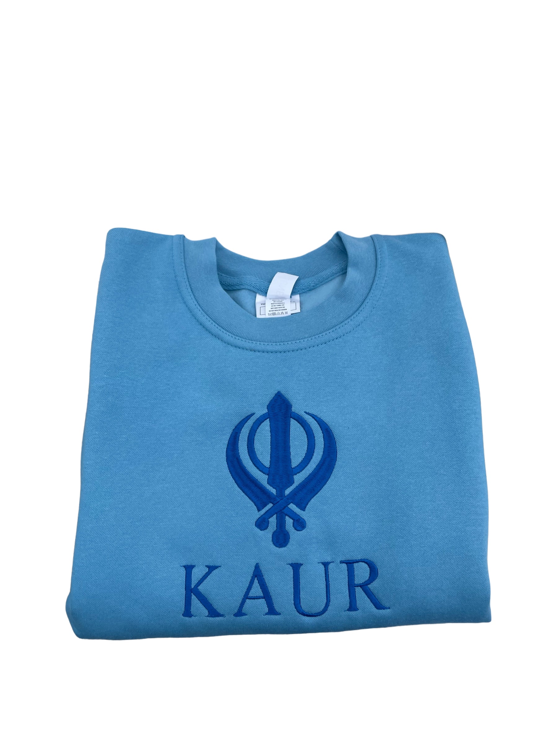 The embroidered KAUR sweater is available in Blue or Pink fabric. Perfect for any young Kaur wanting to incorporate their love of Sikhi with everyday fashion. The intricate embroidery adds a touch of elegance to this cozy piece, making it both stylish and comfortable.