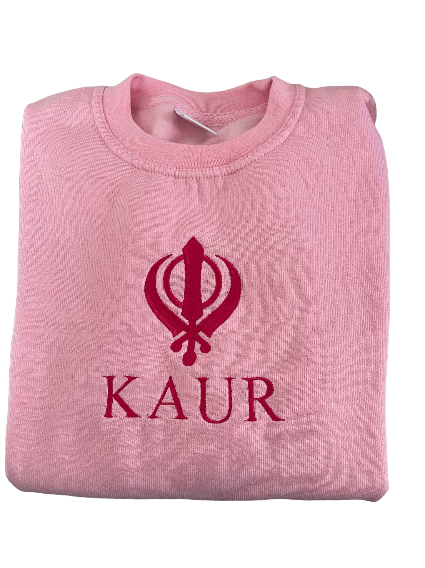 The embroidered KAUR sweater is available in Blue or Pink fabric. Perfect for any young Kaur wanting to incorporate their love of Sikhi with everyday fashion. The intricate embroidery adds a touch of elegance to this cozy piece, making it both stylish and comfortable. 